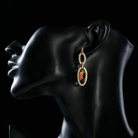 Side angle view of KHAISTA gold plated chain circle drop earrings