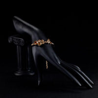 Side angle view of KHAISTA gold plated crystal cluster bracelet