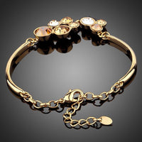 Close up detail of KHAISTA gold plated crystal cluster bracelet