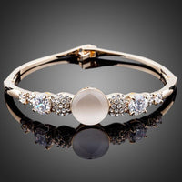 KHAISTA gold plated CZ bracelet bangle on white background