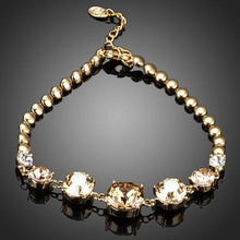 Load image into Gallery viewer, Gold Plated Cubic Zirconia Charm Bracelet - KHAISTA Fashion Jewellery
