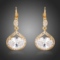 KHAISTA gold plated CZ love drop earrings on white background