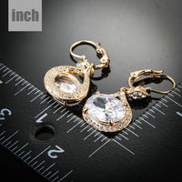 gold plated CZ love drop earrings detail view by KHAISTA