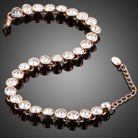 Close up detail of KHAISTA gold plated designer tennis bracelet