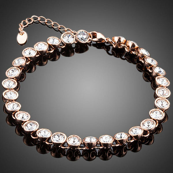 KHAISTA gold plated designer tennis bracelet on white background