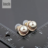 gold plated dome shaped stud earrings detail view by KHAISTA