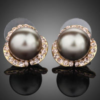 KHAISTA gold plated dome shaped stud earrings on white background