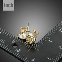 gold plated flower shaped CZ earrings detail view by KHAISTA