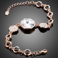 Close up detail of KHAISTA gold plated geometric crystal bracelet