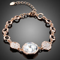 KHAISTA gold plated geometric crystal bracelet on white background