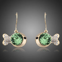 KHAISTA gold plated green crystal fish drop earrings on white background