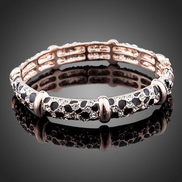 KHAISTA gold plated jaguar print bangle on white background