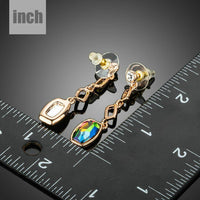 gold plated curved crystal drop earrings detail view by KHAISTA