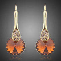 KHAISTA gold plated maple leaf design drop earrings on white background