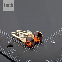 gold plated maple leaf design drop earrings detail view by KHAISTA