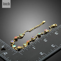 Close up detail of KHAISTA gold plated crystal cluster bracelet