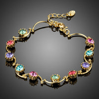 KHAISTA gold plated crystal cluster bracelet on white background