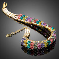 Side angle view of KHAISTA gold plated multicolour crystal bead bracelet