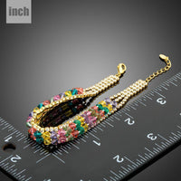 Close up detail of KHAISTA gold plated multicolour crystal bead bracelet