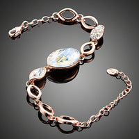 Close up detail of KHAISTA gold plated oval crystal bracelet