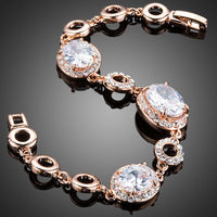 Close up detail of KHAISTA gold plated oval CZ bracelet