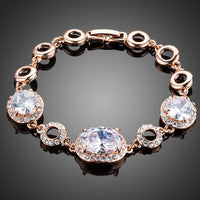 KHAISTA gold plated oval CZ bracelet on white background