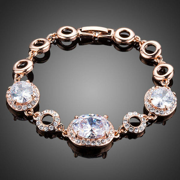 KHAISTA gold plated oval CZ bracelet on white background