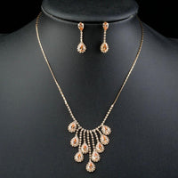 Side angle view of Khaista gold red crystal set