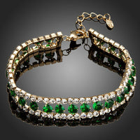 KHAISTA gold plated round green crystal bracelet on white background