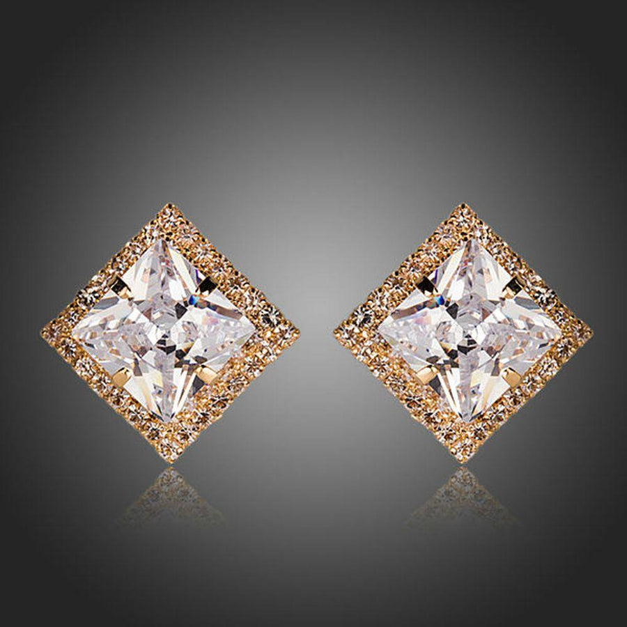 KHAISTA gold plated square CZ stud earrings on white background