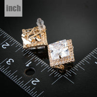gold plated square CZ stud earrings detail view by KHAISTA