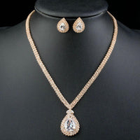 Side angle view of Khaista gold waterdrop set