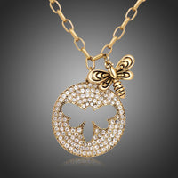KHAISTA gold crystal bee pendant necklace on white background