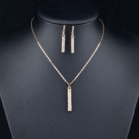 Side angle view of Khaista gold cylindrical set
