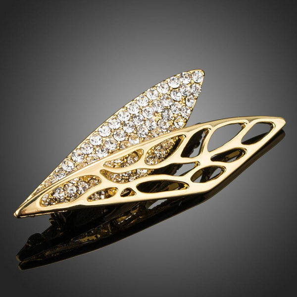 Khaista gold diamante wing brooch pin on white background