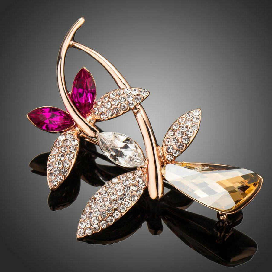 Khaista gold dragonfly brooch pin on white background