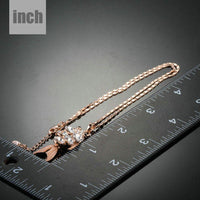 Pendant detail on KHAISTA gold crystal fish pendant necklace
