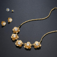 Side angle view of Khaista gold pearl floral set