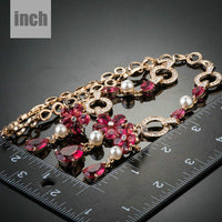 Floral waterdrop detail on Khaista gold garnet set
