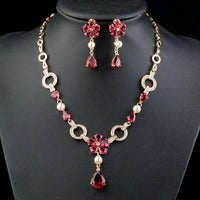 Close-up of garnet and CZ on Khaista gold floral set