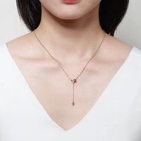 Side angle view of Khaista gold red heart set