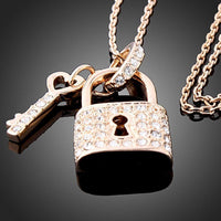 KHAISTA gold padlock love key pendant necklace on white background