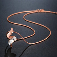 Close up detail of KHAISTA gold paved clear CZ necklace