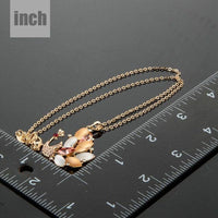 Pendant detail on KHAISTA gold crystal peacock pendant necklace