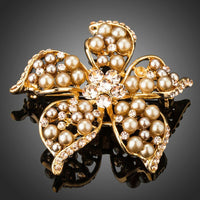 Khaista gold pearl flower brooch pin on white background
