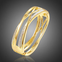 KHAISTA gold reflexions crystal bangle on white background
