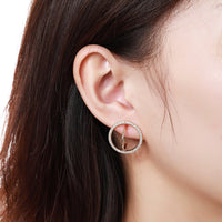 Close up of KHAISTA golden round crystal stud earrings