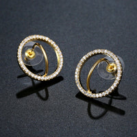 Side angle view of KHAISTA golden round crystal stud earrings