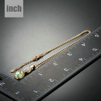 Pendant detail on KHAISTA gold crystal sensation pendant necklace