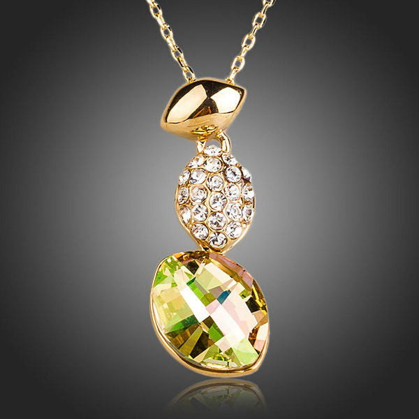 KHAISTA gold crystal sensation pendant necklace on white background